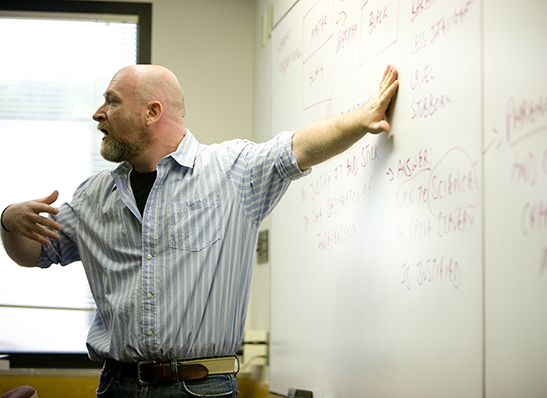 A Cabrini professor at a whiteboard